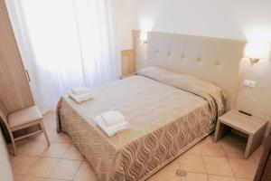 Postel nebo postele na pokoji v ubytování Hotel Alex Square