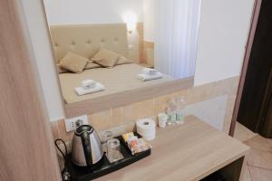 Postel nebo postele na pokoji v ubytování Hotel Alex Square