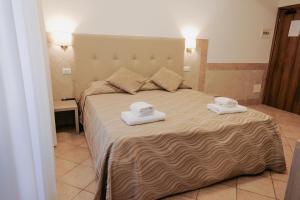 Postel nebo postele na pokoji v ubytování Hotel Alex Square