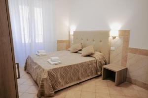 Postel nebo postele na pokoji v ubytování Hotel Alex Square