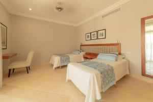 Postel nebo postele na pokoji v ubytování Toquilla Suites - Apartment in Cap Cana, Punta Cana