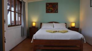 Voodi või voodid majutusasutuse Ventana Sur Hostal toas
