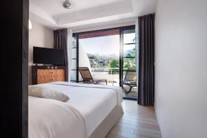 Te Moana Tahiti Resort房間的床