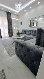 a living room with a couch and a table at Apartments Pepdjonovic in Ulcinj