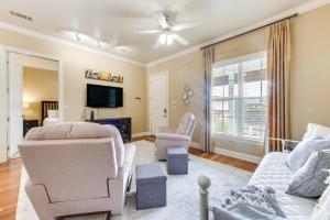 a living room with a couch and chairs and a tv at Lovely Baton Rouge Condo about 1 Mi to LSU in Baton Rouge