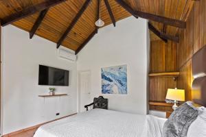 Tempat tidur dalam kamar di H4 LAS CABAÑAS