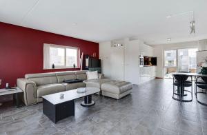 a living room with a couch and a table at Cairo in Almere
