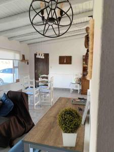 a living room with a table and a dining room at PataGo! Sea&Sand in Playa Unión