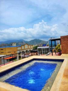 a swimming pool on the roof of a building at Hotel Boutique Casa Carolina in Santa Marta