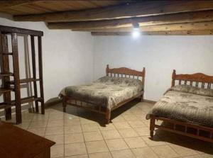 Säng eller sängar i ett rum på Cabañas De Lolita En Barrancas del cobre
