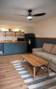 a living room with a couch and a coffee table at The Inn at the Gate in Skaneateles