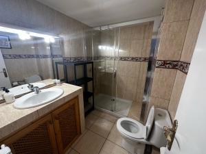 a bathroom with a toilet and a sink and a shower at Vista Hermosa in Portals Nous +28 photos