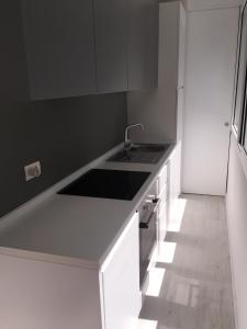 A kitchen or kitchenette at Duomo Inn