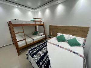 Letto o letti in una camera di HOTEL TORRE DELUXE ¨SANTORINI¨