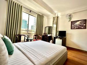 Postel nebo postele na pokoji v ubytování ACE Hotel - Bến Thành