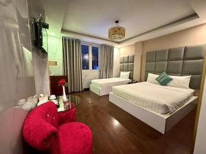Postel nebo postele na pokoji v ubytování ACE Hotel - Bến Thành