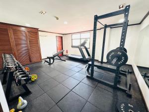 a room with a gym with several tread machines at Lao Orchid Hotel in Vientiane