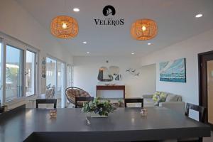 a living room with a table and a couch at Casa Veleros, Casa a la orilla de la playa! in Ciudad Madero