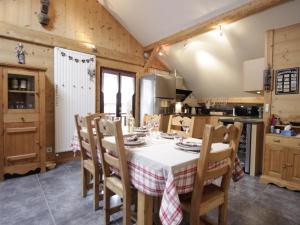 a kitchen and dining room with a table and chairs at Appartement Morzine, 3 pièces, 6 personnes - FR-1-754-54 in Morzine