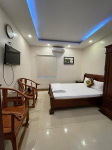 Letto o letti in una camera di Phúc Quý -149B Lê Duẩn HN - by BAY LUXURY