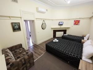 Кровать или кровати в номере Albury Central Motel
