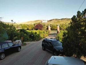 a couple of cars parked on a street at Bed and Breakfast L' Aranciera in Corigliano Calabro