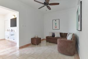 a living room with a couch and a ceiling fan at New! Lovely And Spacious Fully Equipped Condo In Cap Cana in Punta Cana