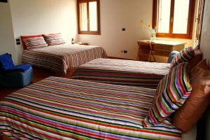 Postel nebo postele na pokoji v ubytování B&B Allo Spizzo