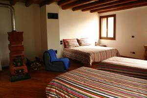 Postel nebo postele na pokoji v ubytování B&B Allo Spizzo