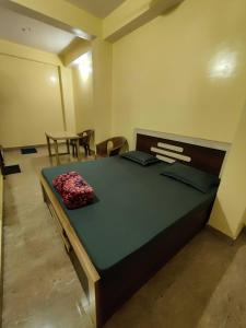 Krevet ili kreveti u jedinici u okviru objekta OYO Flagship Adhunik Lodge