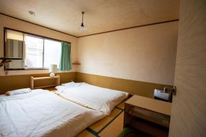 Postel nebo postele na pokoji v ubytování Guesthouse Bon