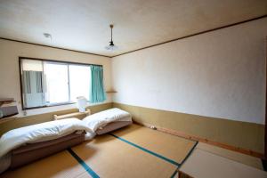 Postel nebo postele na pokoji v ubytování Guesthouse Bon