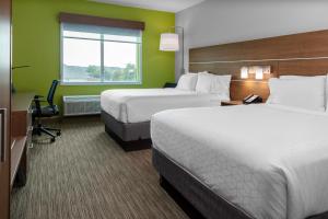 Postel nebo postele na pokoji v ubytování Holiday Inn Express & Suites Leander by IHG + 19 fotografií