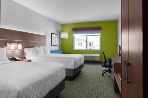 Postel nebo postele na pokoji v ubytování Holiday Inn Express & Suites Leander by IHG