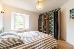 Postel nebo postele na pokoji v ubytování Gîte de Kerduraison - Maison avec grand jardin