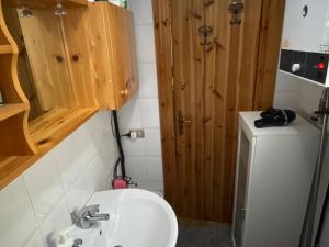 a small bathroom with a sink and a toilet at Villaggio Palumbo Sila - Appartamento in Cotronei