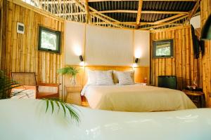 Ένα ή περισσότερα κρεβάτια σε δωμάτιο στο Treehouse de Valentine