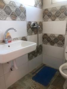 a bathroom with a sink and a toilet at U Villi BB2 Gornji Zalik bb in Mostar