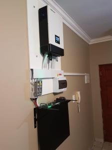 a machine on top of a refrigerator in a room at Kingfisher 15 - Home away from home in Margate