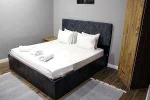 Postel nebo postele na pokoji v ubytování biglife hotel