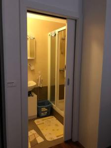 a bathroom with a shower and a sink at AC apartment in Okrug Gornji