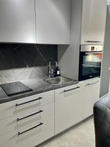 Kuchyň nebo kuchyňský kout v ubytování Apartman Loft 72