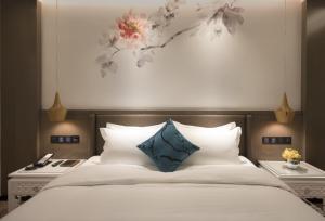 Postel nebo postele na pokoji v ubytování Paco Hotel Dongpu Guanghzou -Free Shuttle Bus for Canton Fair