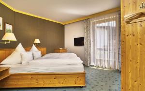 Postel nebo postele na pokoji v ubytování Hotel Das Bayerwald