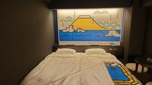 Postel nebo postele na pokoji v ubytování HOTEL TAVINOS Kyoto