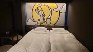 Postel nebo postele na pokoji v ubytování HOTEL TAVINOS Kyoto