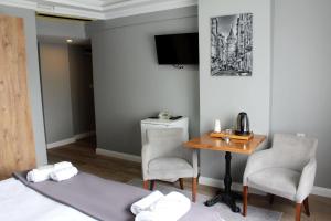 Postel nebo postele na pokoji v ubytování biglife hotel