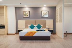 Postel nebo postele na pokoji v ubytování Hotel Sentral Riverview Melaka