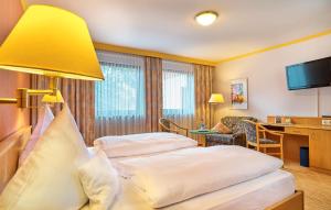 Postel nebo postele na pokoji v ubytování Hotel Das Bayerwald