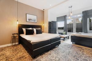 Rúm í herbergi á Hotel Maassluis